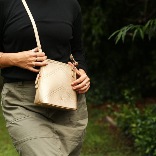 VERA MAY DAYNA GOLD VEGAN LEATHER HANDBAG