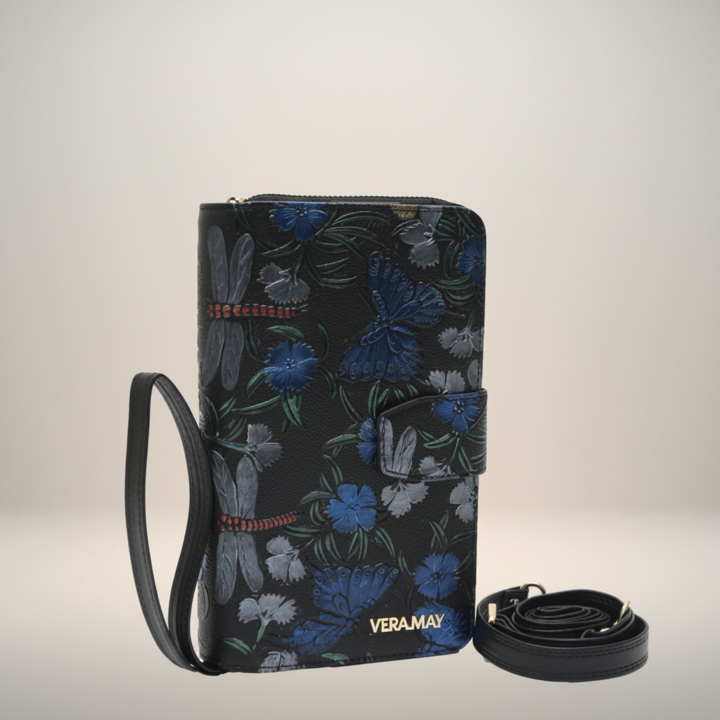 Floral patterned bag with strap and visible brand name on a white background